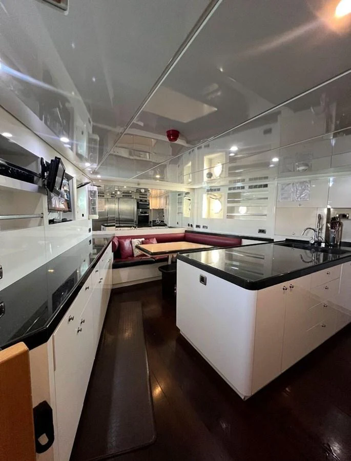 a large kitchen with a large glass wall aboard WHISPER Yacht for Sale