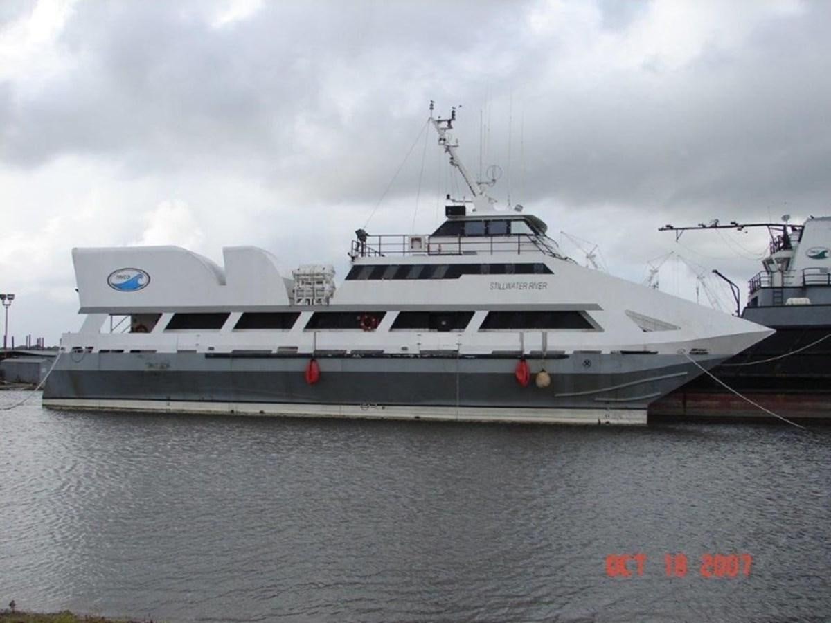 a large white boat in the water aboard 1999 EASTERN SWATH 120 Yacht for Sale