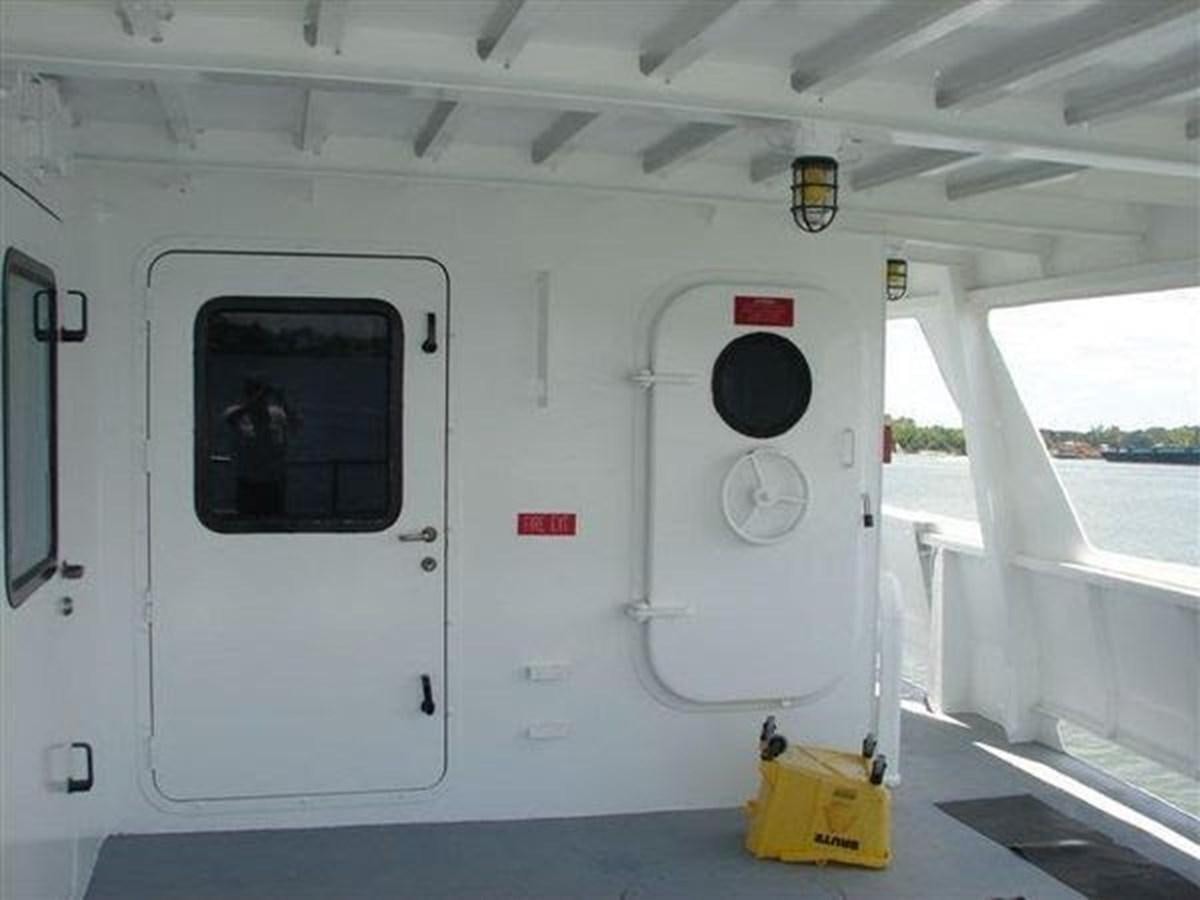 a white vehicle with a black circle on the front aboard 1999 EASTERN SWATH 120 Yacht for Sale