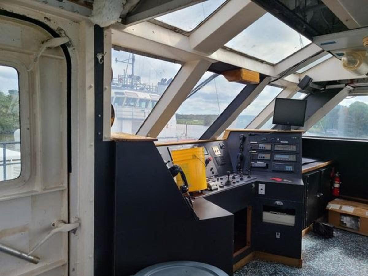 a room with a desk and computer aboard 1999 EASTERN SWATH 120 Yacht for Sale