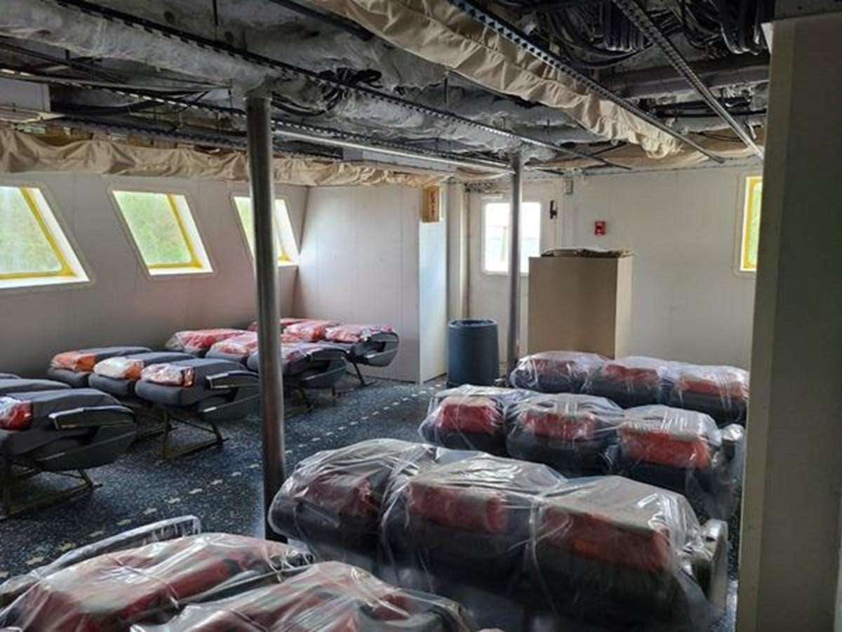 a room with couches and a bed aboard 1999 EASTERN SWATH 120 Yacht for Sale