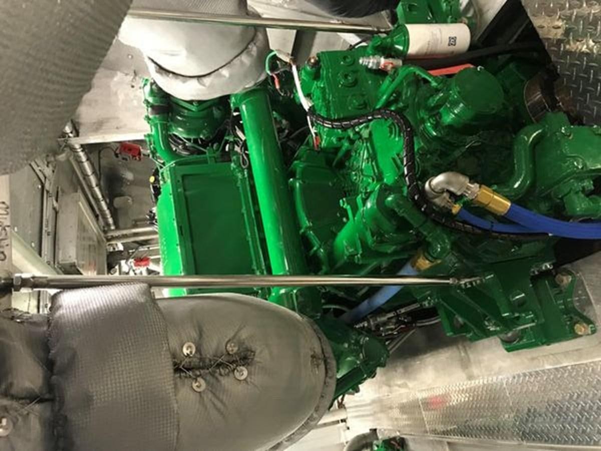 a car engine with green pipes aboard DREAM STAR Yacht for Sale
