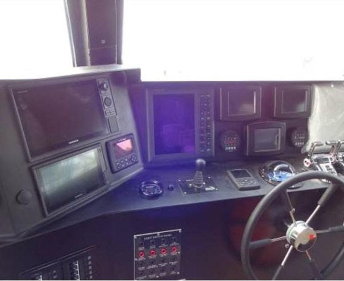 a room with electronic equipment and a fan aboard DREAM STAR Yacht for Sale