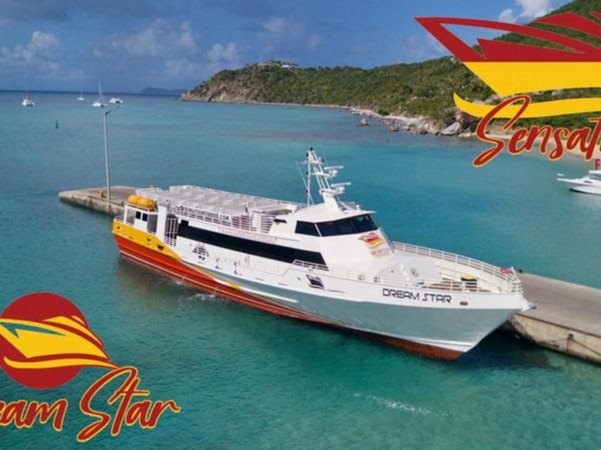 a large boat in the water aboard DREAM STAR Yacht for Sale