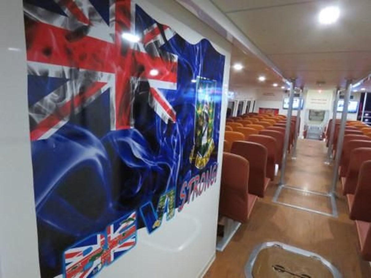 a room with chairs and a painting aboard DREAM STAR Yacht for Sale