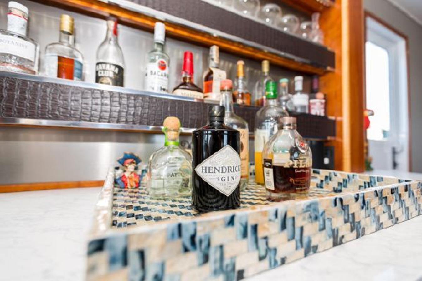 bottles of alcohol on a table aboard ISLAND SOUL Yacht for Sale