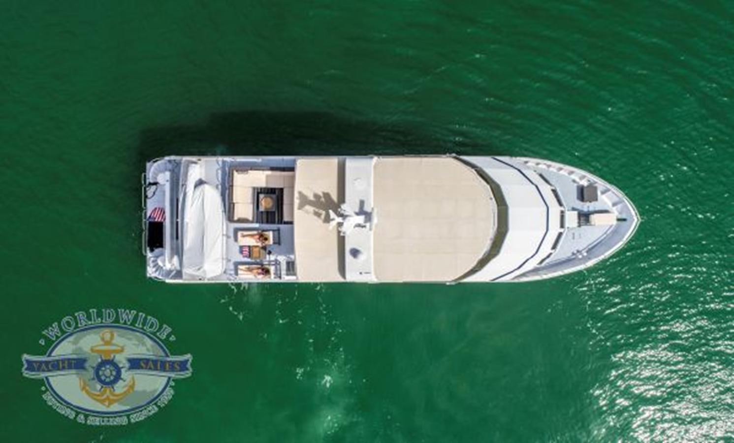 a white house on a green surface aboard ISLAND SOUL Yacht for Sale