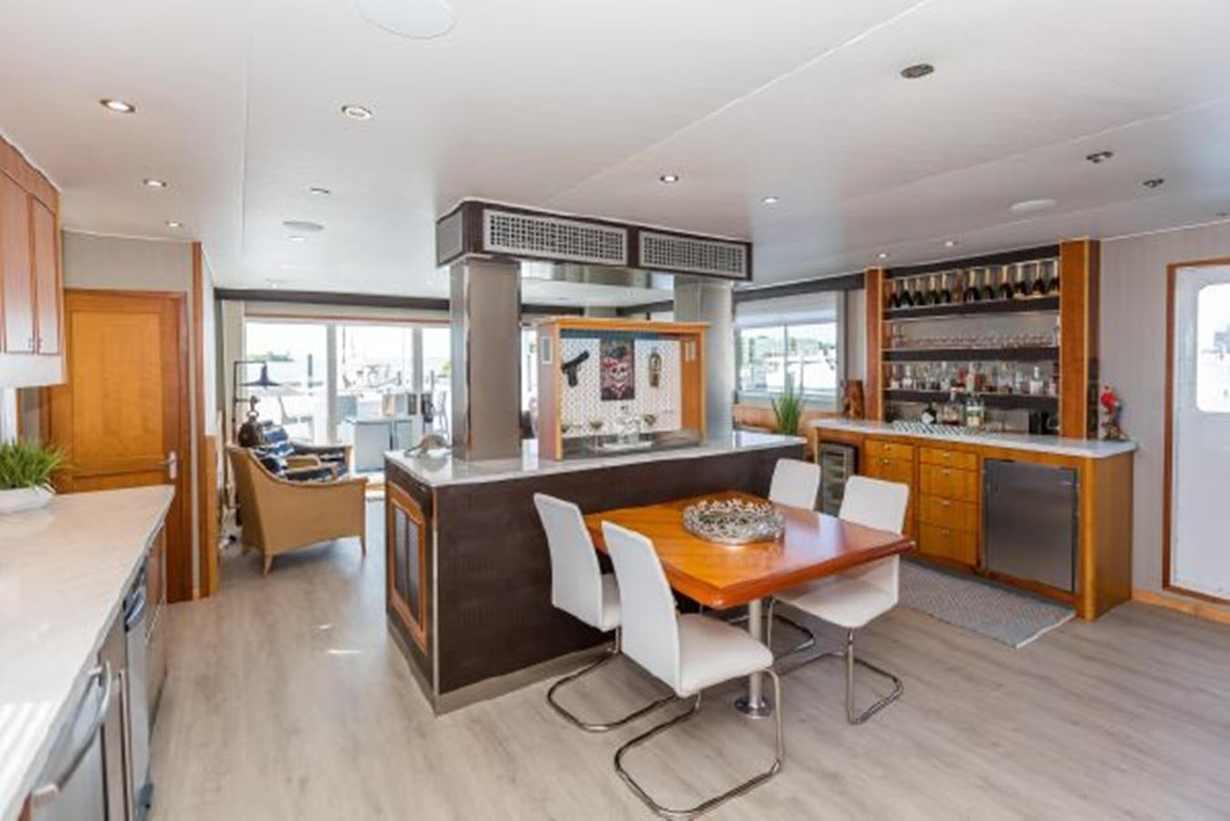 a kitchen with a table and chairs aboard ISLAND SOUL Yacht for Sale