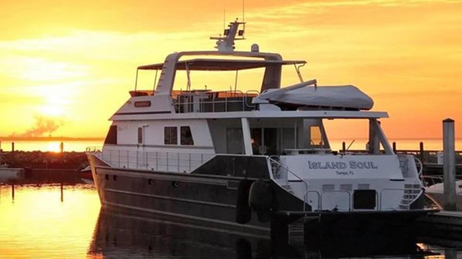 a couple of boats docked at sunset aboard ISLAND SOUL Yacht for Sale