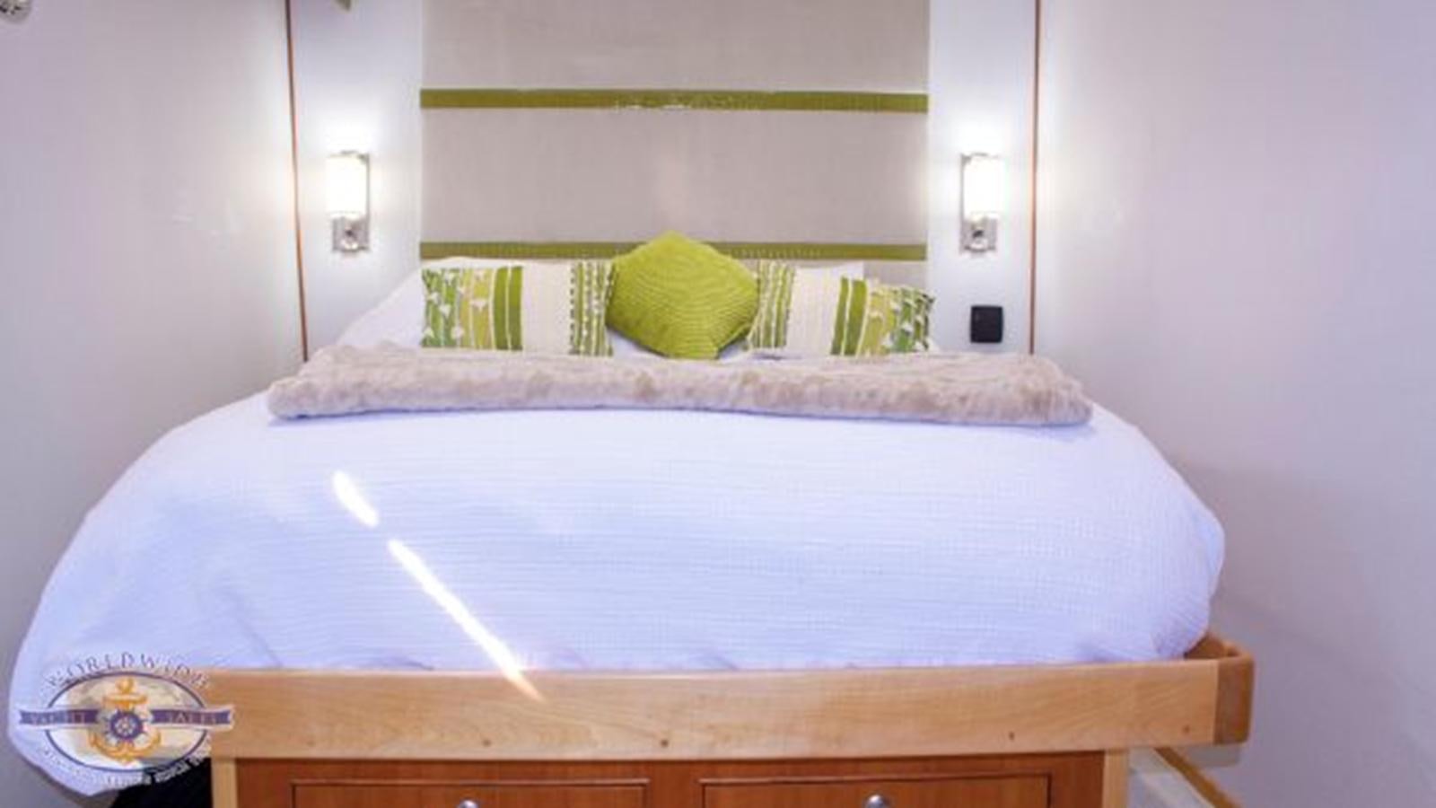 a bed with a pillow and a pillow on it aboard ISLAND SOUL Yacht for Sale