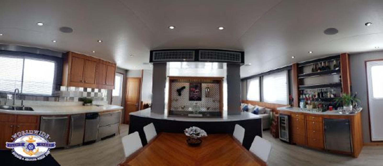 a kitchen with a fireplace aboard ISLAND SOUL Yacht for Sale