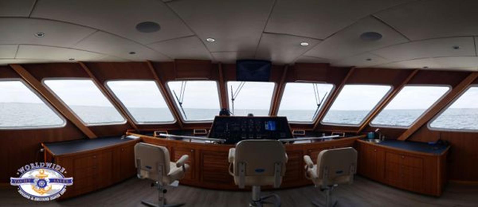 a room with a desk and chairs aboard ISLAND SOUL Yacht for Sale