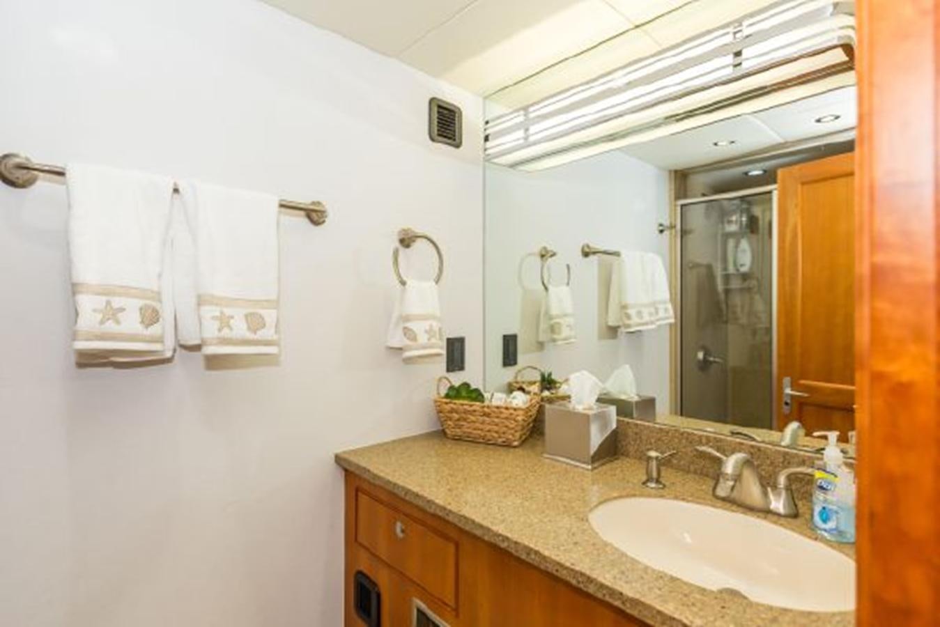 a bathroom with a sink and towels aboard ISLAND SOUL Yacht for Sale