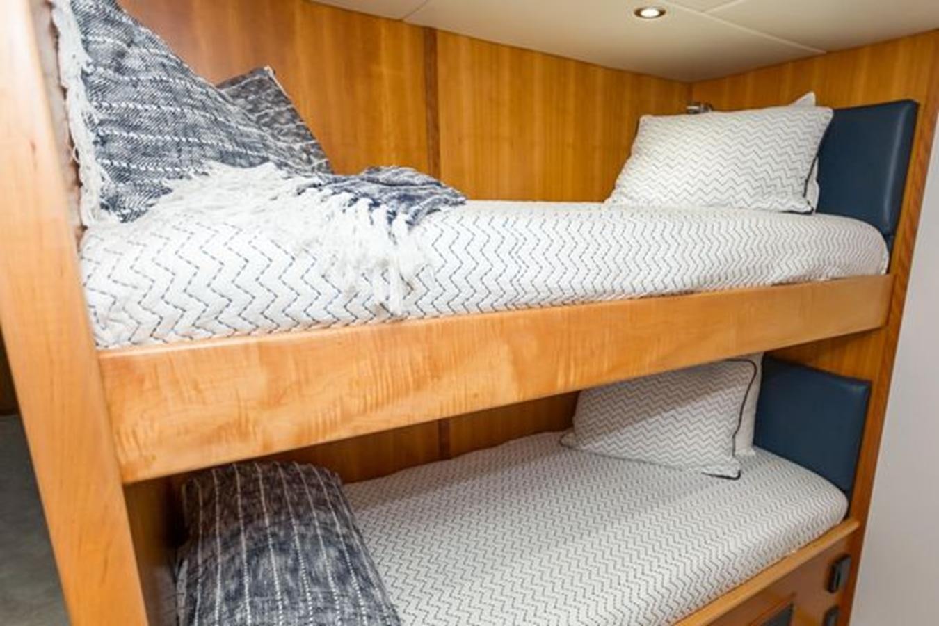 a bed with white sheets aboard ISLAND SOUL Yacht for Sale