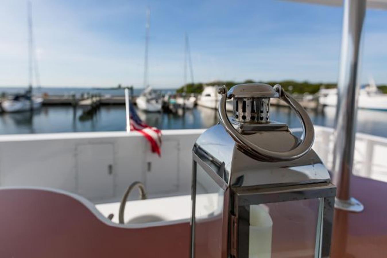 a boat with a flag on the front aboard ISLAND SOUL Yacht for Sale