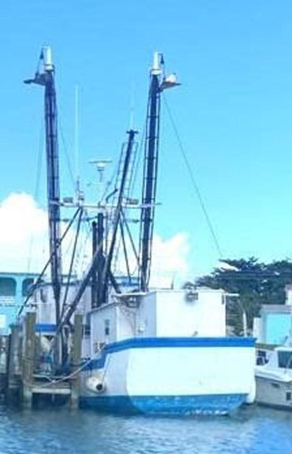 a boat in the water aboard 1980 ST. AUGUSTINE 78 TRAWLER Yacht for Sale