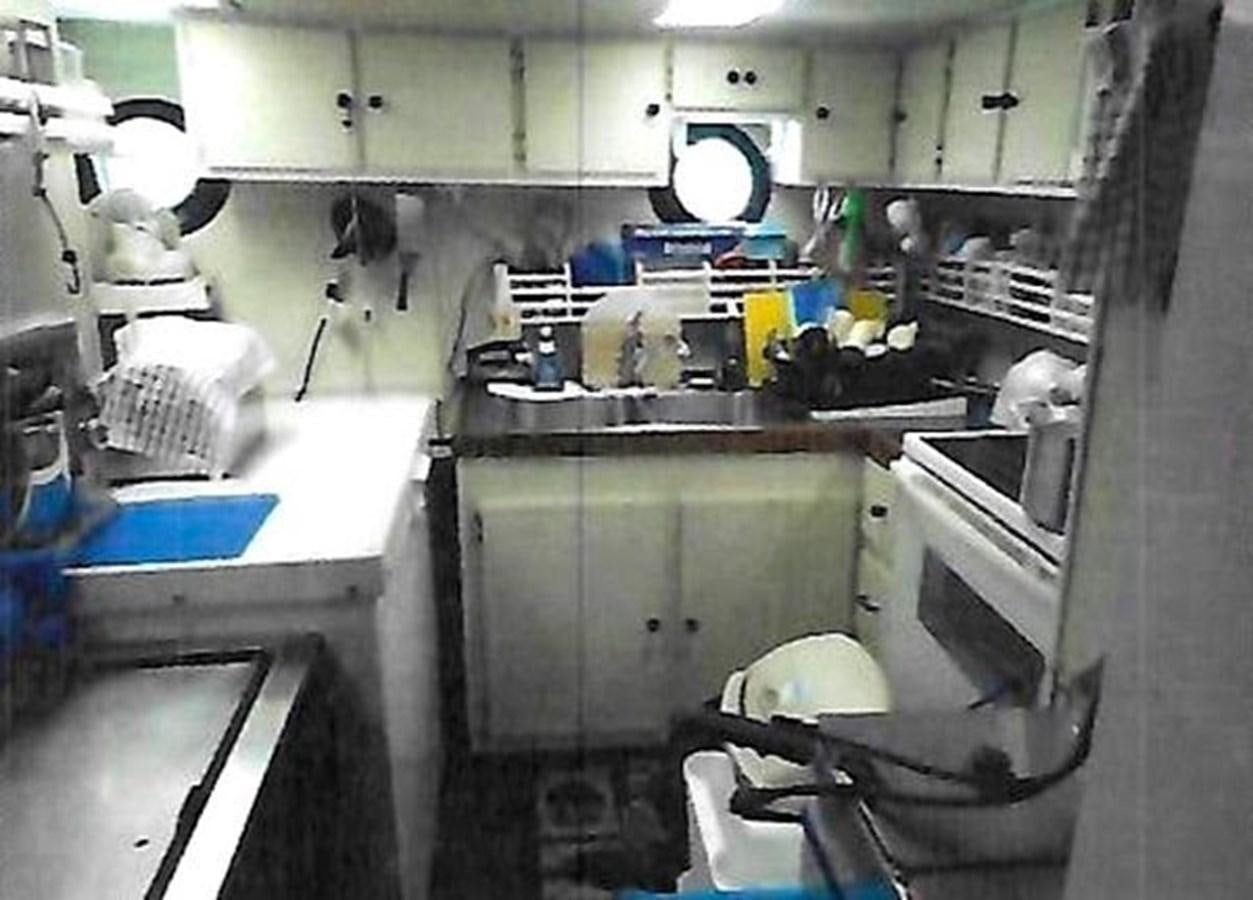 a room with a sink and a mirror aboard 1980 ST. AUGUSTINE 78 TRAWLER Yacht for Sale