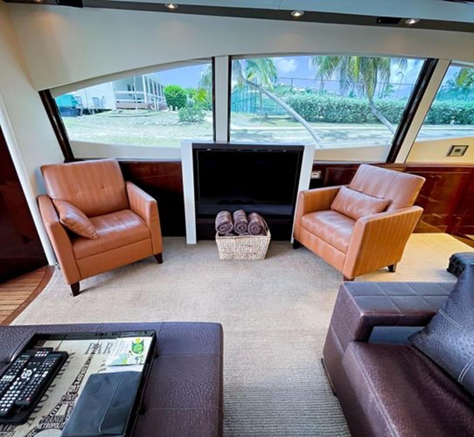 a living room with a fireplace aboard LOVIN LIFE Yacht for Sale