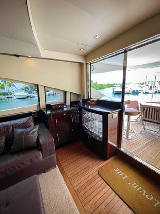 a living room with a wood floor aboard LOVIN LIFE Yacht for Sale