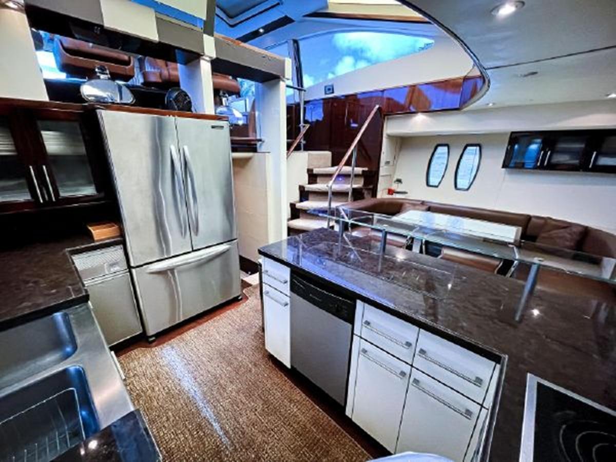 a kitchen with a large island aboard LOVIN LIFE Yacht for Sale