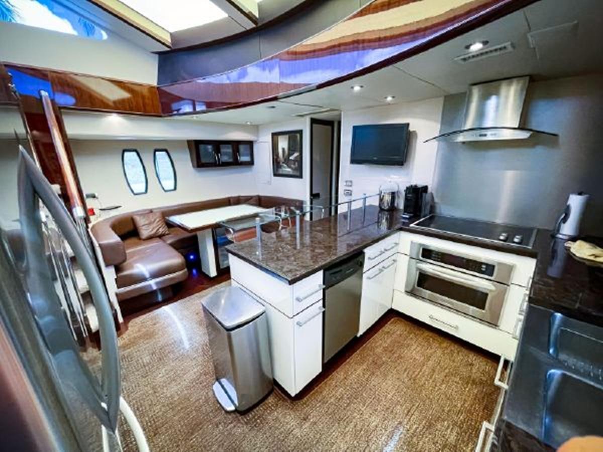 a kitchen with a large island aboard LOVIN LIFE Yacht for Sale