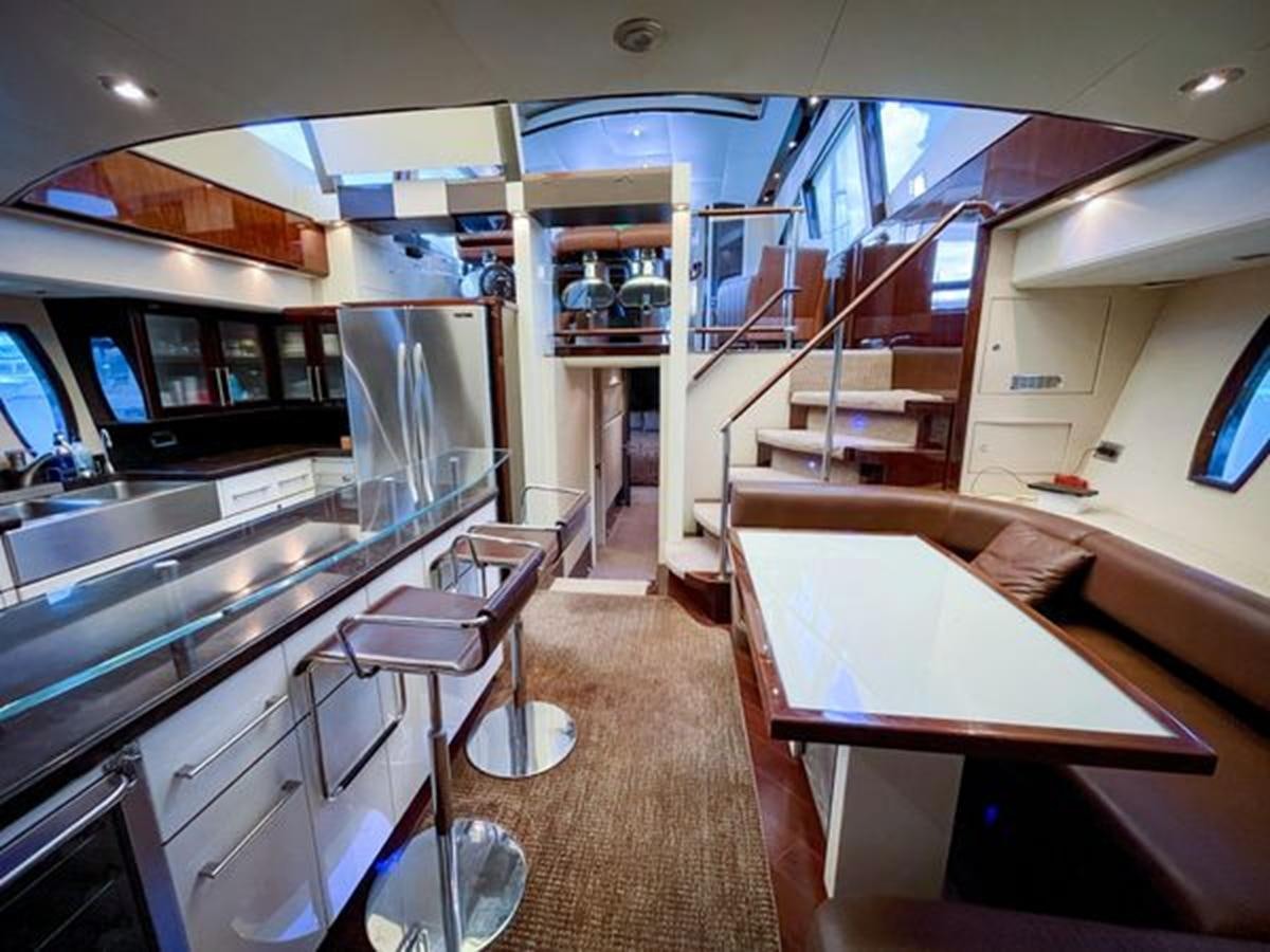 a kitchen with a dining area aboard LOVIN LIFE Yacht for Sale