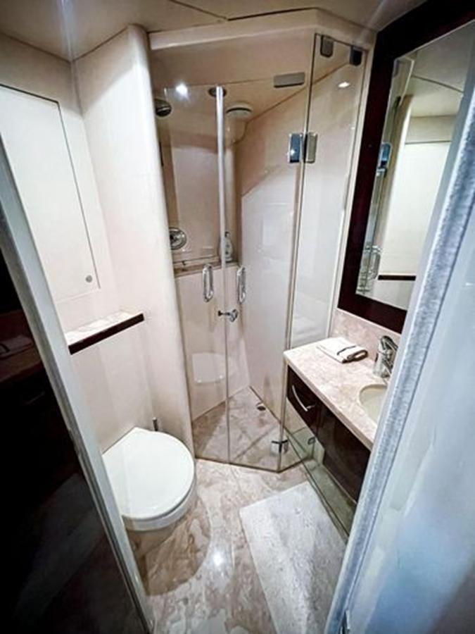 a bathroom with a sink and a toilet aboard LOVIN LIFE Yacht for Sale