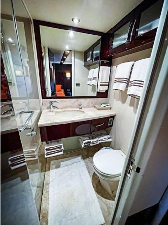 a bathroom with a large mirror aboard LOVIN LIFE Yacht for Sale