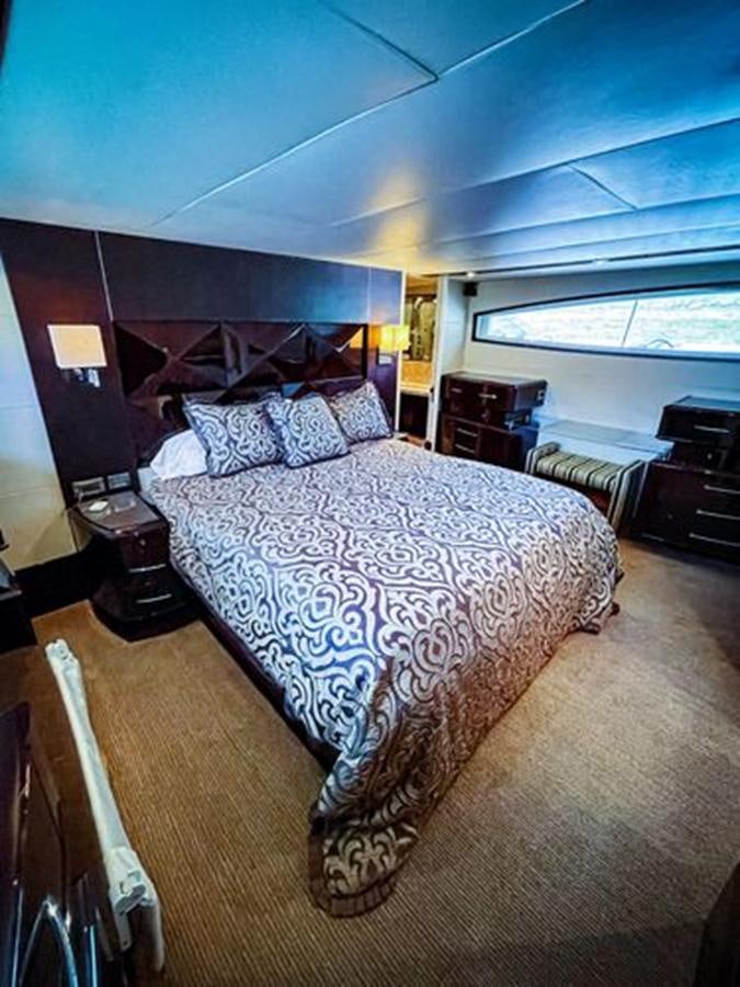 a bedroom with a large bed aboard LOVIN LIFE Yacht for Sale
