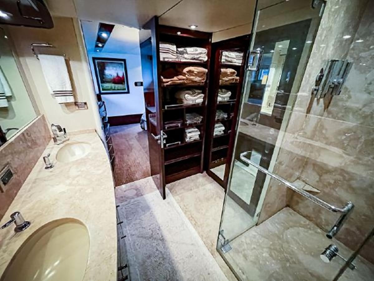 a bathroom with a glass shower aboard LOVIN LIFE Yacht for Sale