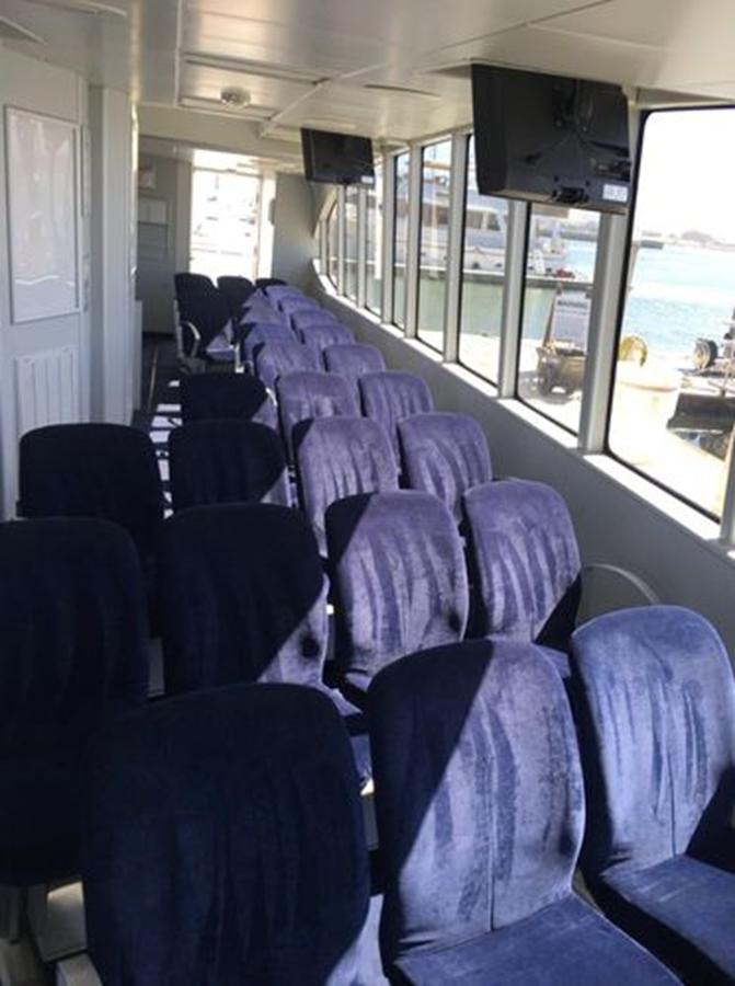 a bus with rows of seats aboard F350TXR Yacht for Sale
