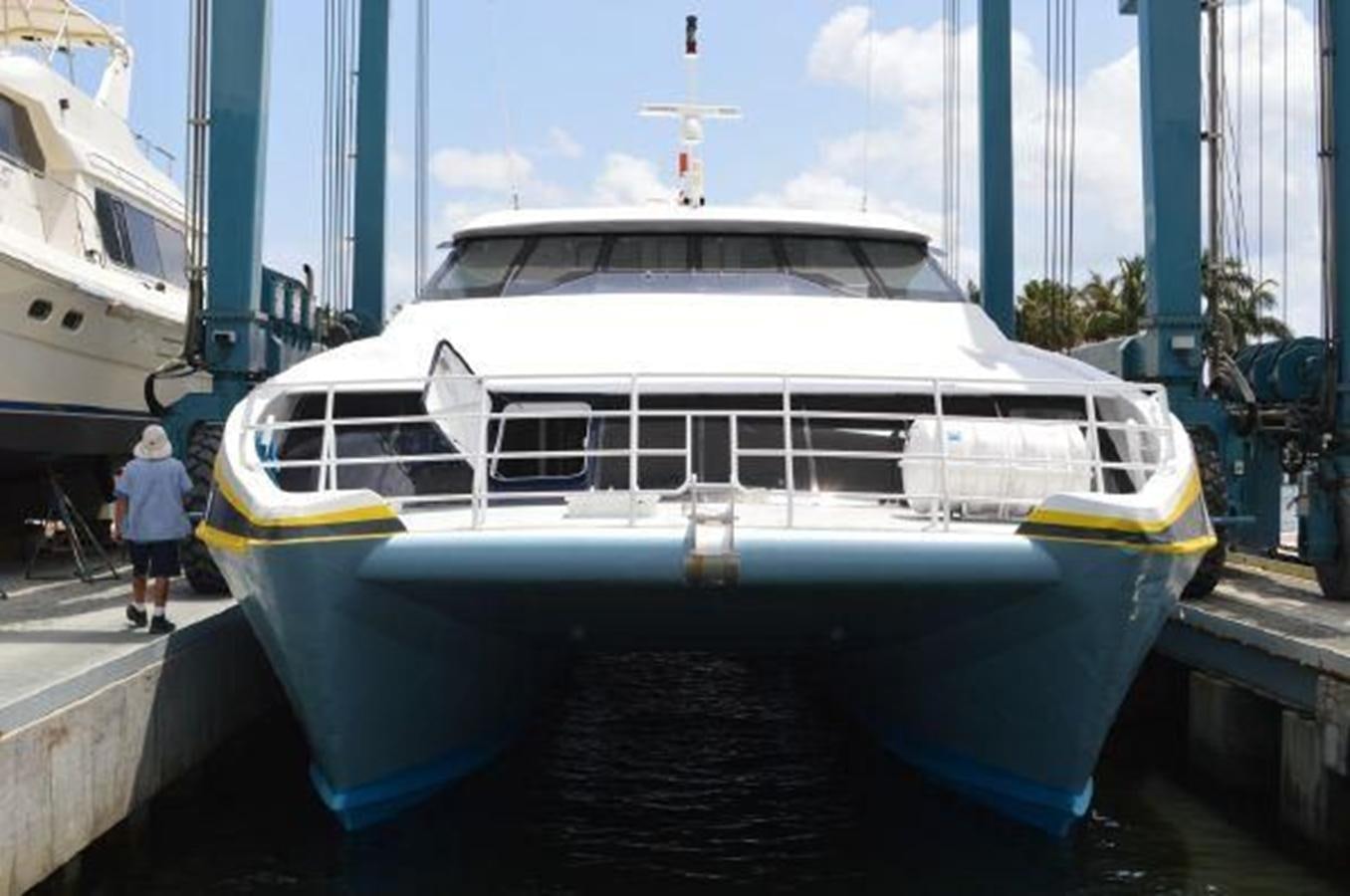 a large white boat in a harbor aboard F350TXR Yacht for Sale