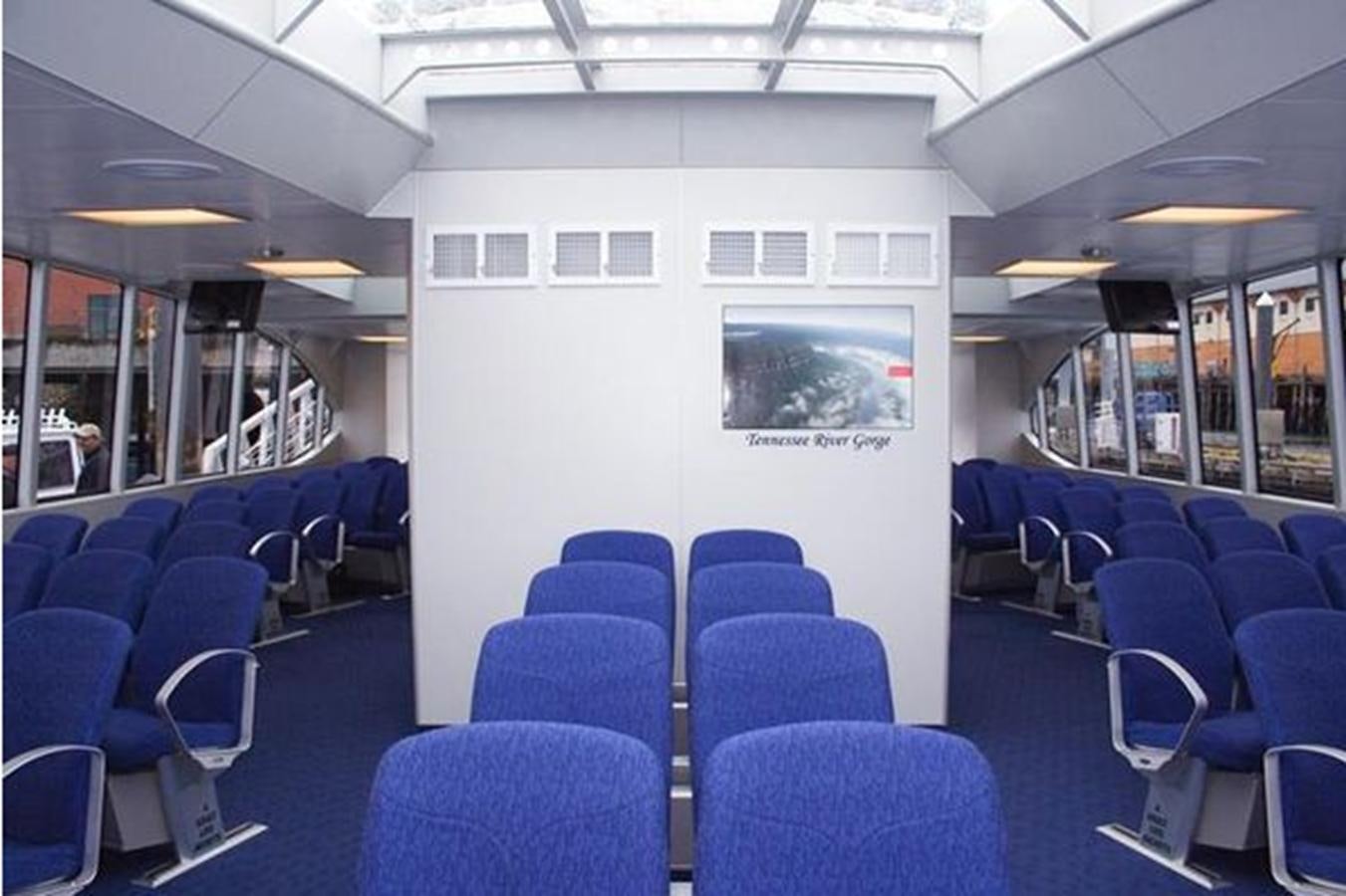 a room with blue chairs and a white board aboard F350TXR Yacht for Sale