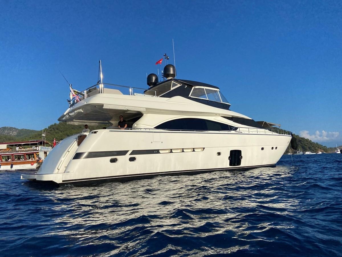 a white yacht on the water aboard ADF Yacht for Sale