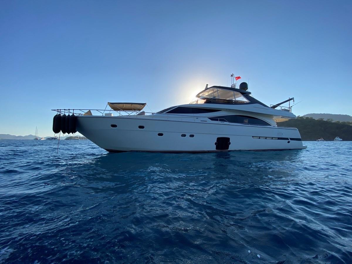 a white yacht on the water aboard ADF Yacht for Sale