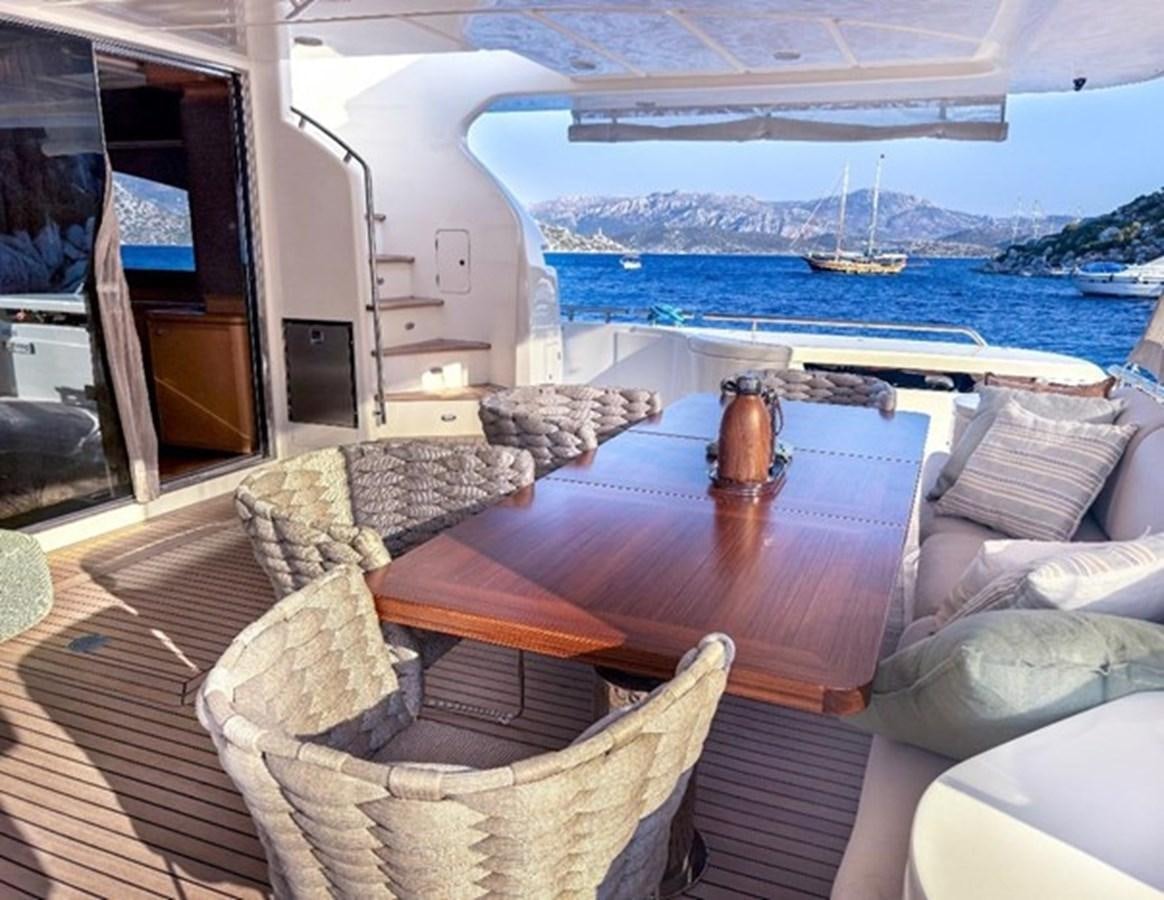 a living room with a large balcony aboard ADF Yacht for Sale