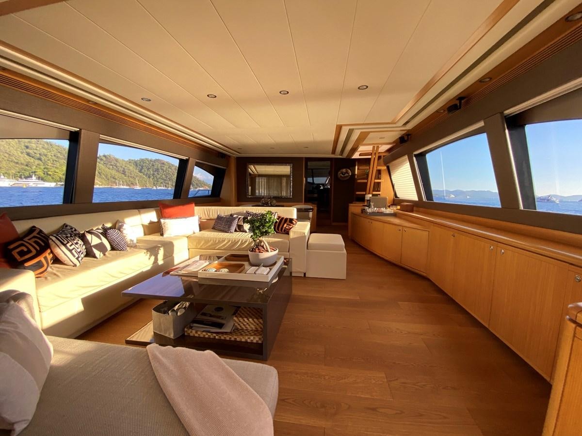 a living room with a large window aboard ADF Yacht for Sale