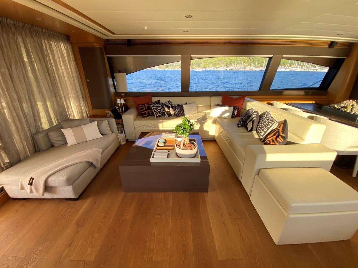a living room with a large window aboard ADF Yacht for Sale
