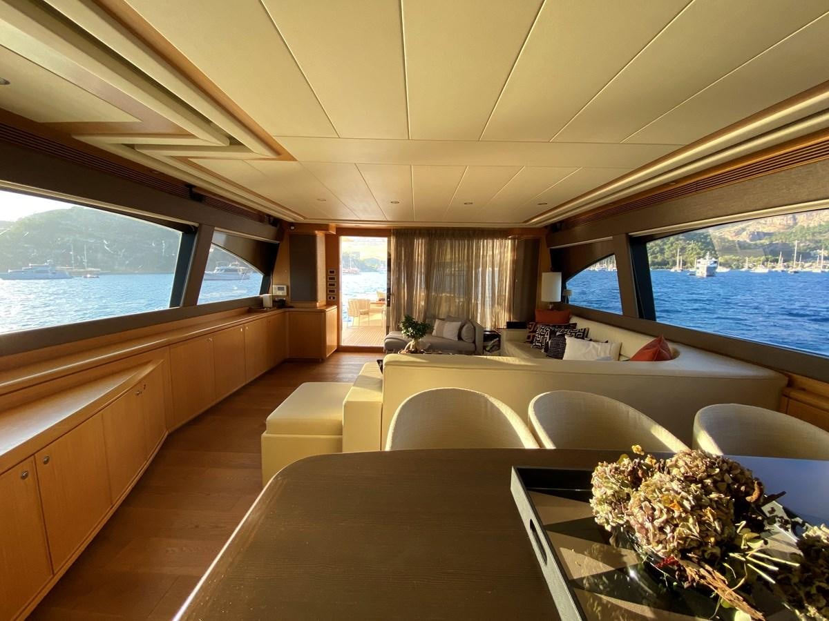 a room with a table and chairs aboard ADF Yacht for Sale