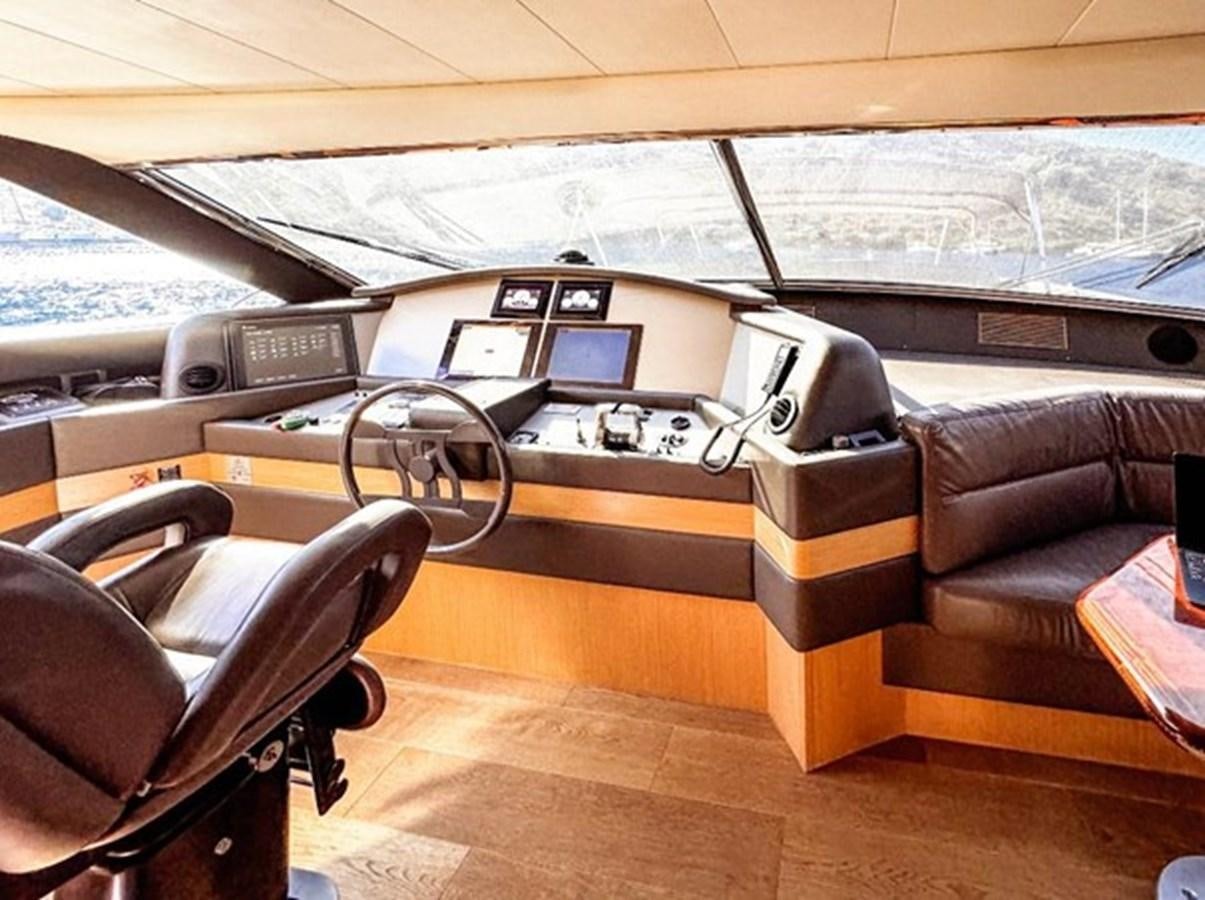 a table with a laptop on it aboard ADF Yacht for Sale