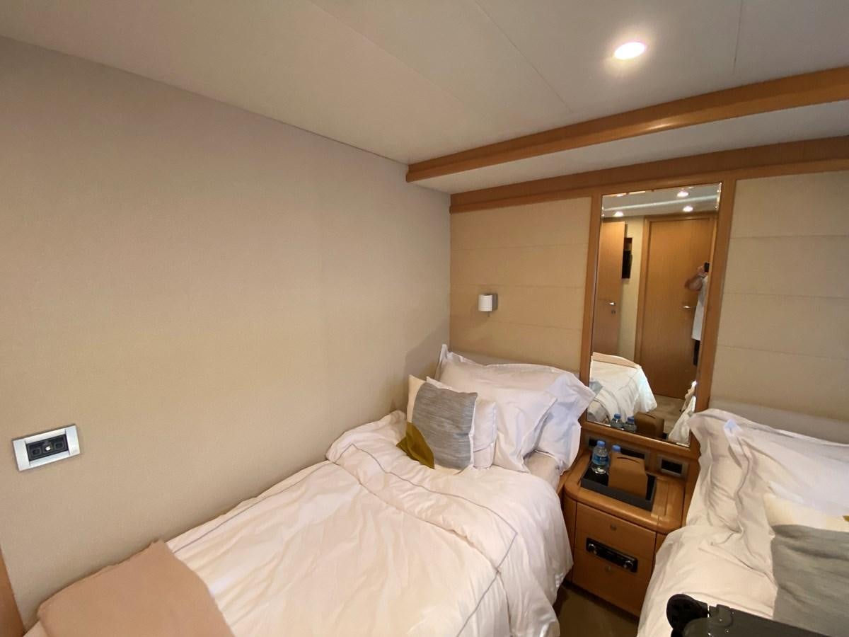 a hotel room with a mirror aboard ADF Yacht for Sale