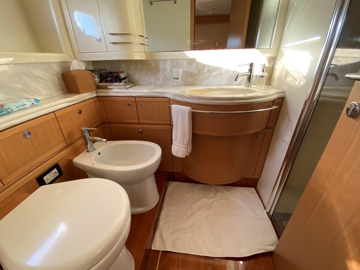 a bathroom with a toilet and sink aboard ADF Yacht for Sale