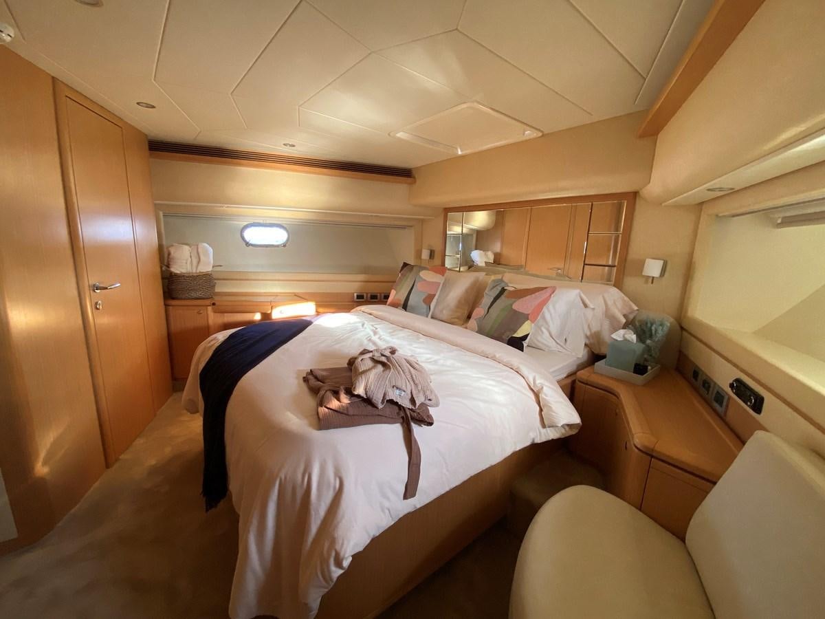 a room with a bed and a desk aboard ADF Yacht for Sale