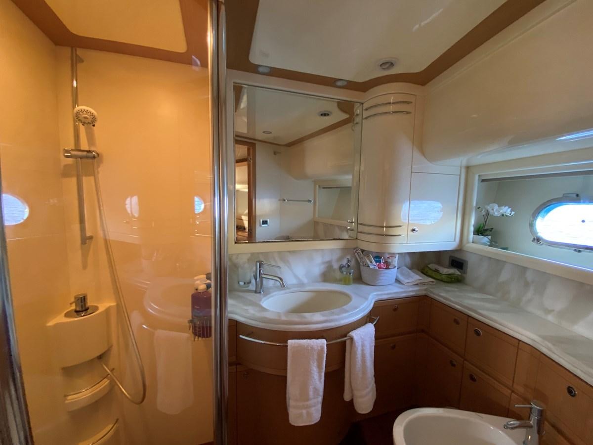 a bathroom with a sink and a mirror aboard ADF Yacht for Sale
