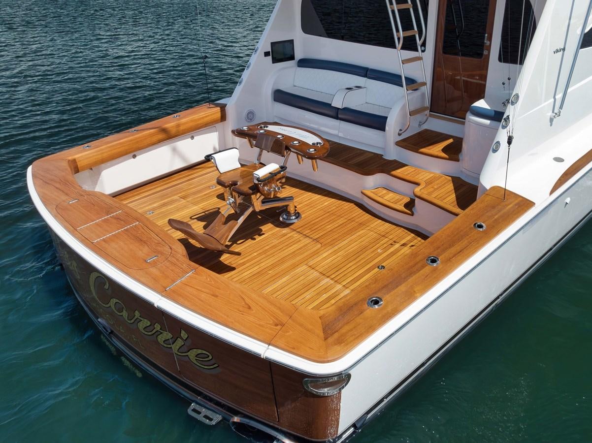 a wooden boat on a deck aboard MISS CARRIE Yacht for Sale