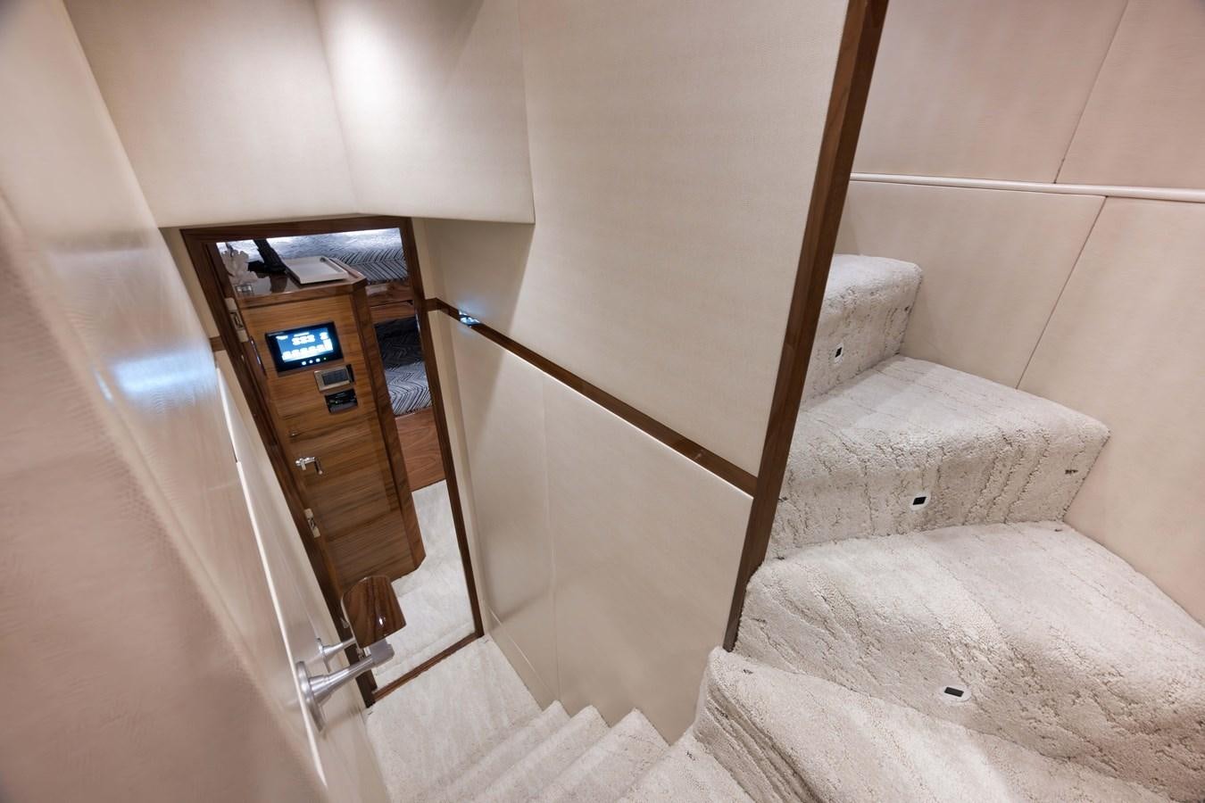 a bed and a chair in a room aboard MISS CARRIE Yacht for Sale