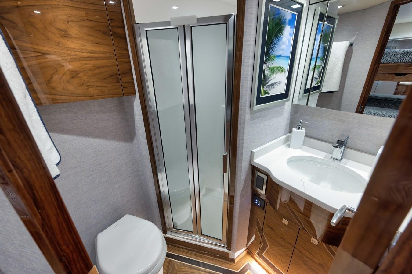 a bathroom with a glass shower aboard MISS CARRIE Yacht for Sale