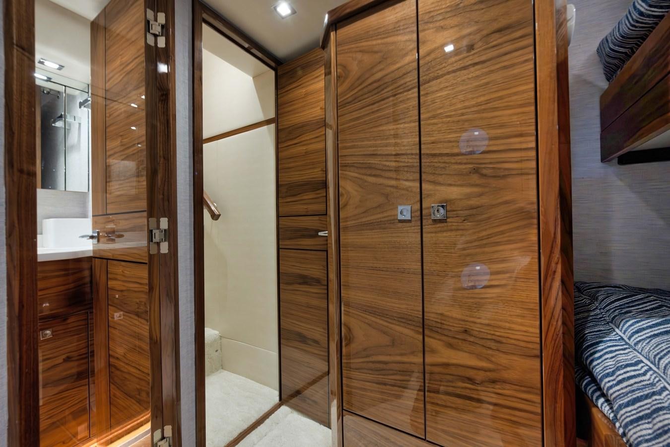 a room with a closet aboard MISS CARRIE Yacht for Sale