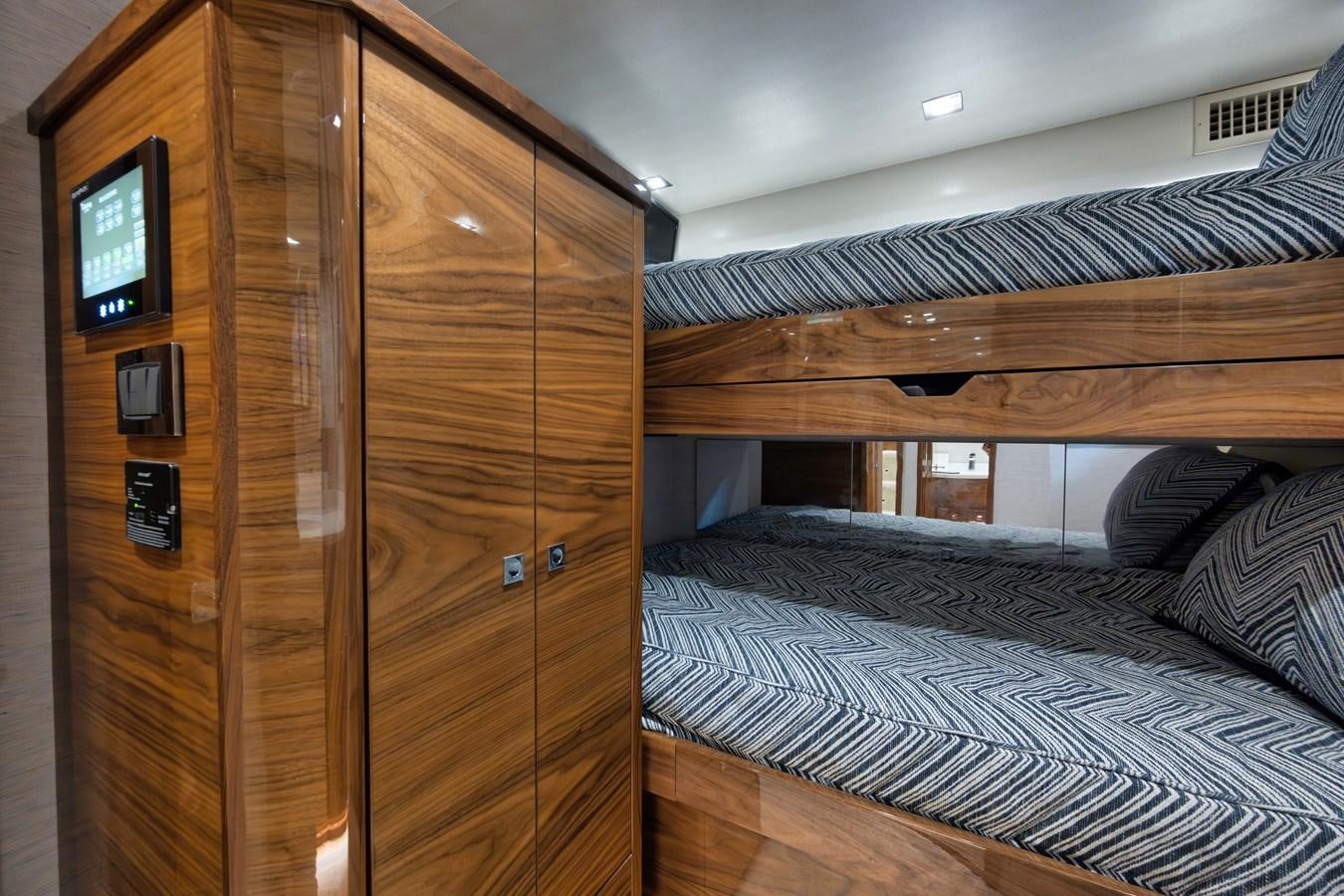 a room with a bed and a tv aboard MISS CARRIE Yacht for Sale