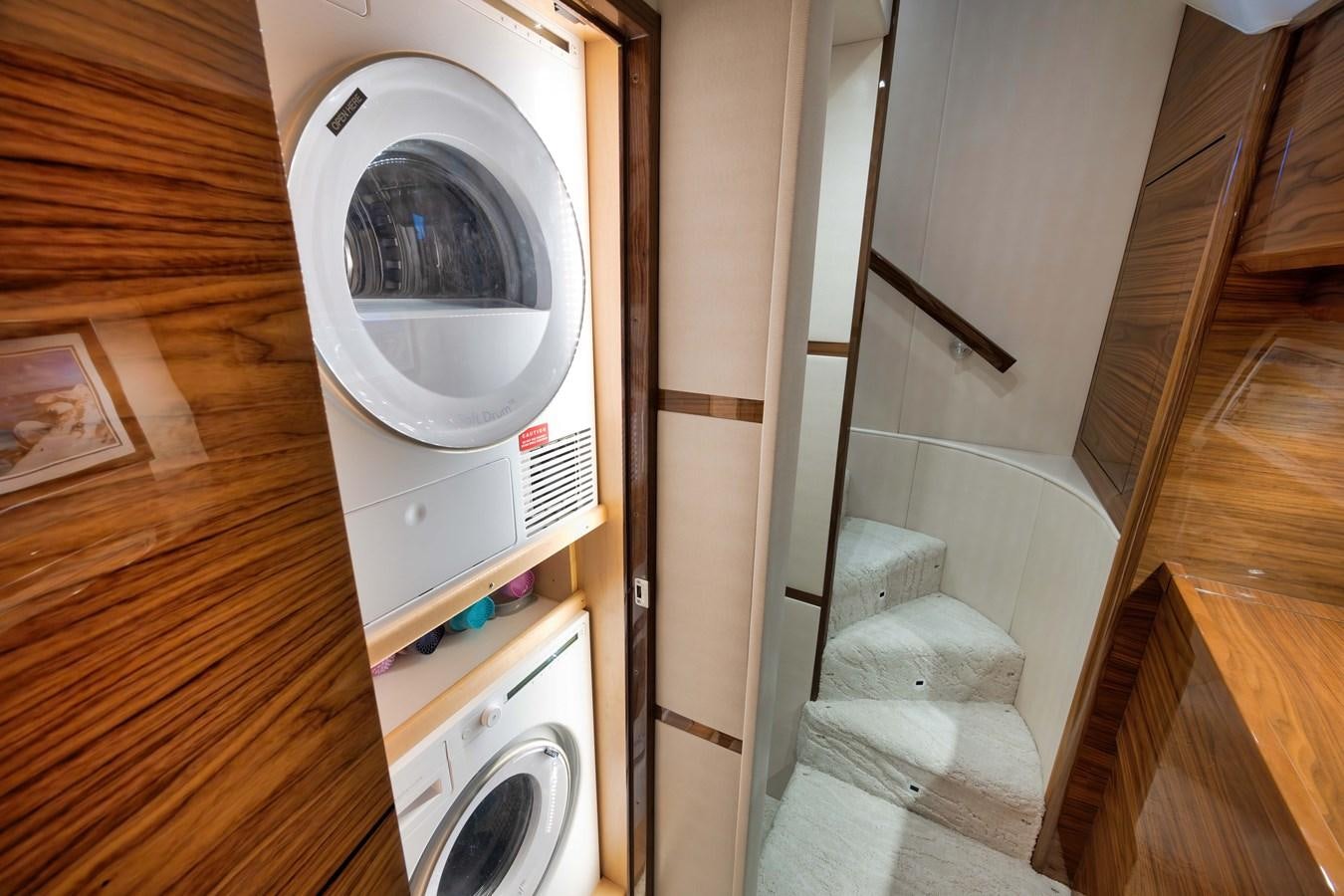 a washing machine in a room aboard MISS CARRIE Yacht for Sale